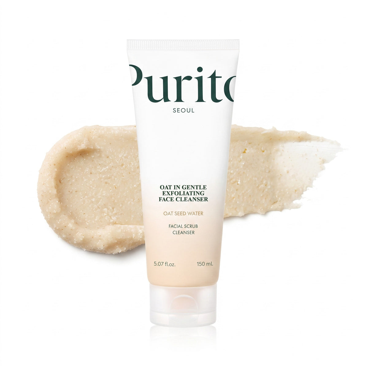 Purito Seoul Oat in Gentle Exfoliating Face Cleaner in a 100ml squeeze tube, shown with a beige exfoliating scrub smear behind it on a white background.