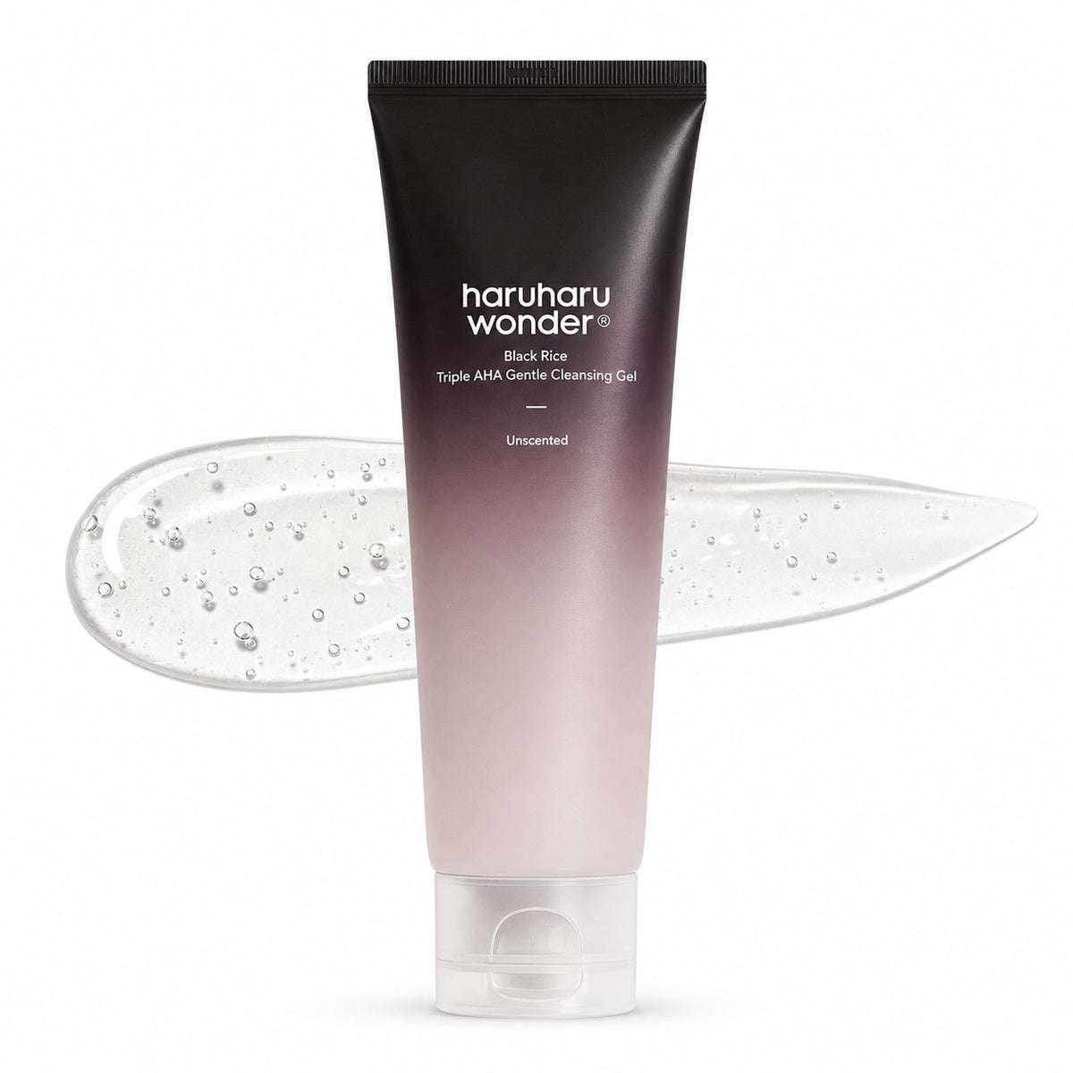 A squeeze tube of haruharu wonder Black Rice Triple Alpha Gentle Cleansing Gel, featuring a black-to-pale-pink gradient design, shown with a translucent gel smear behind it on a white background.
