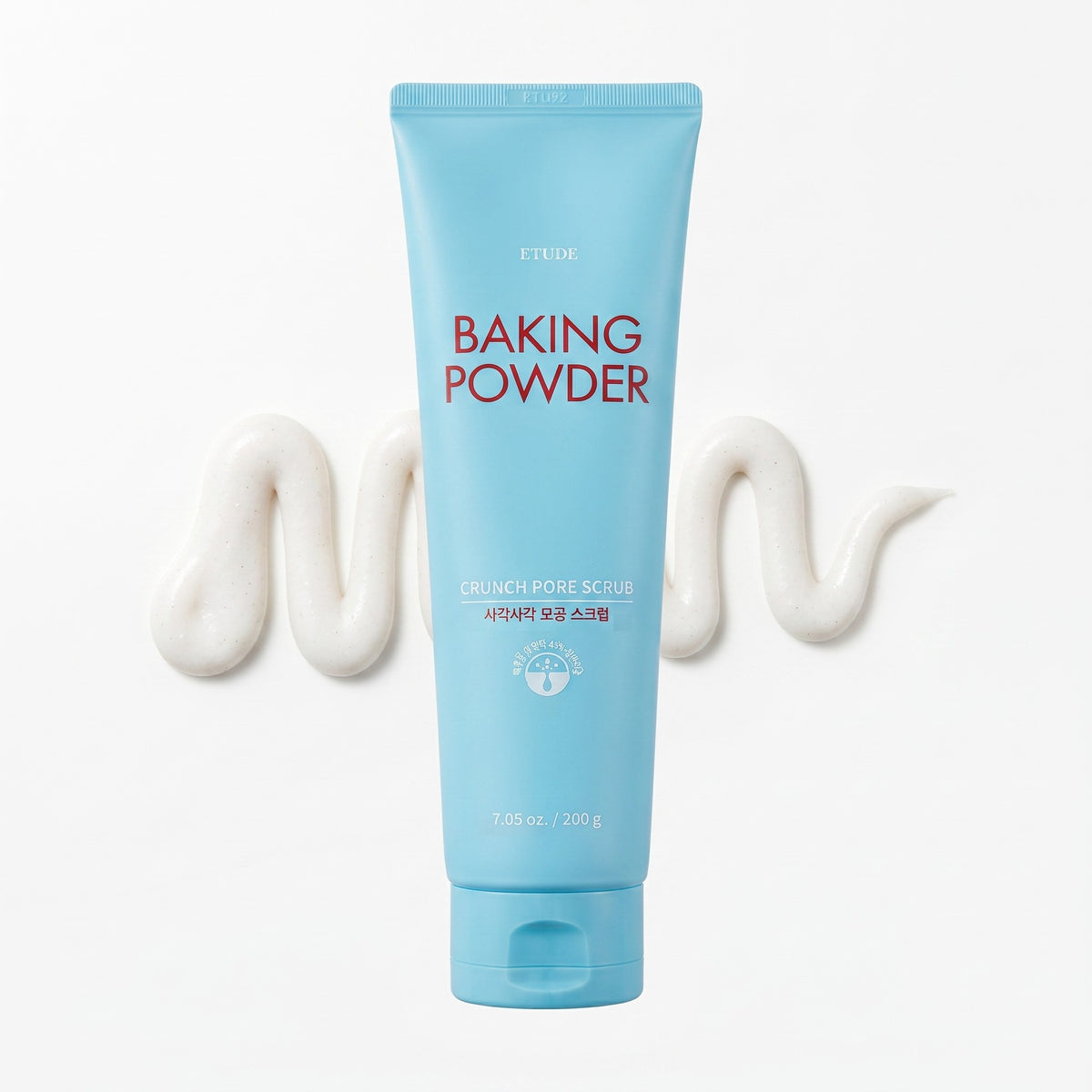 A light blue squeeze tube of ETUDE Baking Powder centered on a white background, with decorative white cream swirls on both sides.