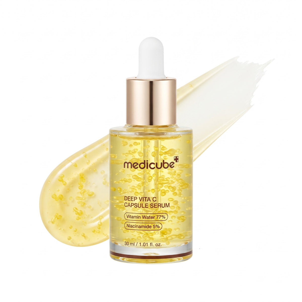 Medicube Deep Vita CI Capsule Serum in a clear glass dropper bottle with a gold collar and white dropper top, shown on a white background with a translucent yellow gel smear behind it.
